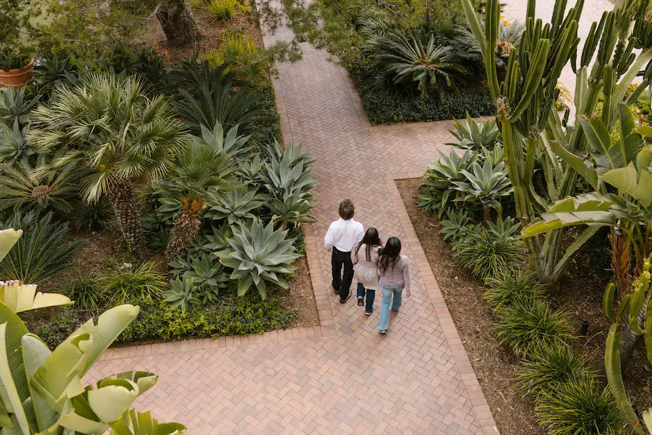 A family walking through a lush garden in Balboa Park, with a large fountain in the background